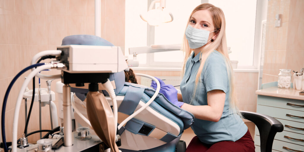 Dentist with patient under sedation dentistry